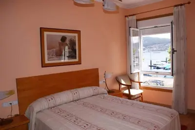 Image de Beachfront villa with private garden and patio and free parking on the street.