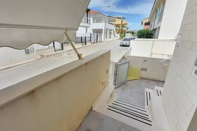 Image de Appartamento Odisseo D: A cozy apartment situated at a few steps from a sandy beach, with Free Wi-Fi.