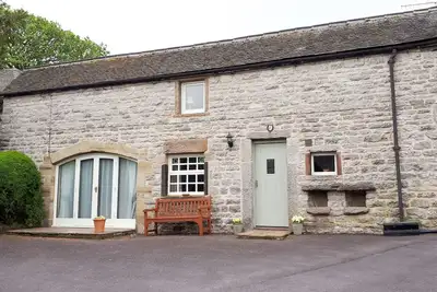 Image de L'ancien Coach House est maintenant un gîte confortable situé dans un cadre idyllique