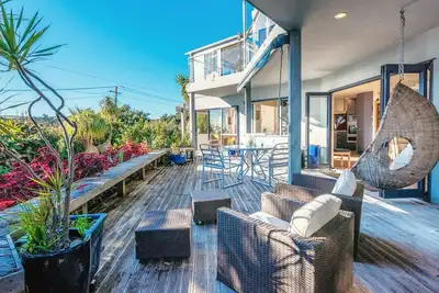 A perfectly located with views over Oneroa Bay and plenty of room family!