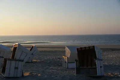 Image de Appartement pour 4 P. directement sur la plage de Wangerooge