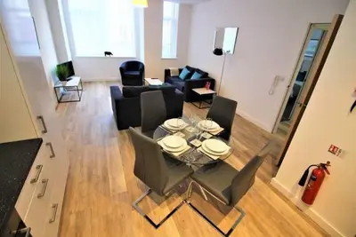 Image de Appartement au rez-de-chaussée avec une chambre
