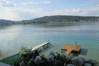 Image de Maison de lac onirique directement au Wörthersee