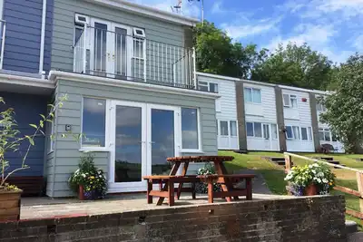 Image de 'Seahorse' - une maison de vacances avec balcon, patio et vue sur la mer