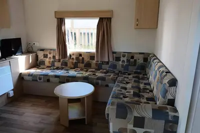 Image de Mobilhome standard 34m² (3 ch-6/7 pers) + terrasse) 6 à 7 personnes - 6 pers. inclus dans le tarif