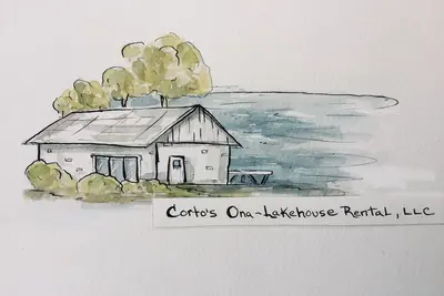 Image de Ona-Lakehouse Rental, Llc de Corto est une maison de location de vacances au bord du lac