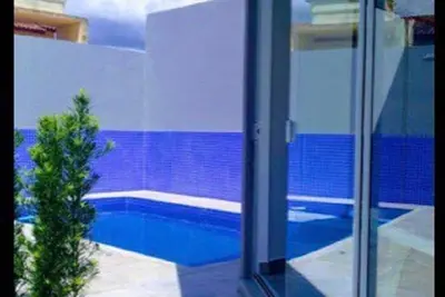 Image de Maison à 100 mètres de la plage avec piscine chauffée par des plaques solaires et hydro