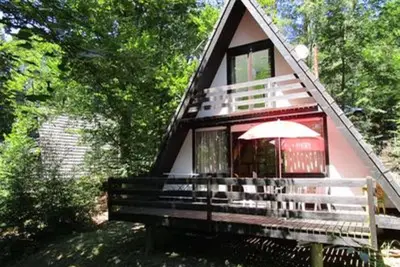 Image de Chalet confortable (environ 70m²) avec escalier en colimaçon et parking