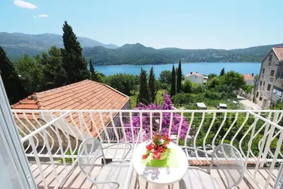 Image de Apartments & Room Eva Slano - Chambre Double avec Balcon et Vue sur la Mer (Kamara)