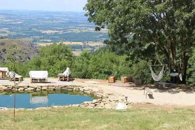 Image de Grange rénovée 122 m2 + grande Terrasse en bois + Bassin Naturel + spa + soins