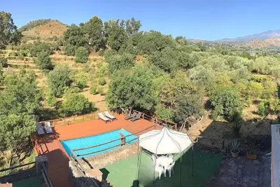 Image de Villa Carlina C: Un appartement caractéristique et accueillant qui fait partie d'un ancien manoir.