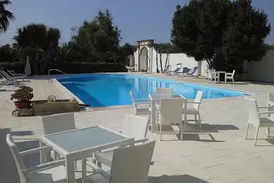 Image de Villa Lippia B: Un appartement caractéristique et accueillant qui fait partie d'une villa de deux étages dans le style caractéristique de la campagne des Pouilles.