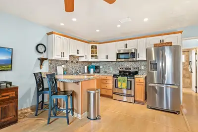 Image de Vue sur le jardin tropical dans une propriété en bord de plage-Kihei Kai Unit 19