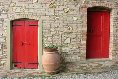 Image de Agriturismo Le Capanne: ferme biologique nichée dans les collines toscanes