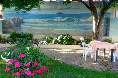 Image de Appartement avec véranda panoramique, jardin aménagé et zone Arbatax
