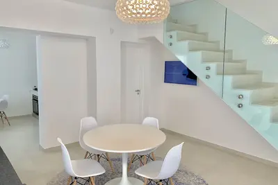 Image de Beach House, à 10 mètres de la plage, détente, histoire, fans, bel emplacement