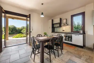 Image de Agréable appartement Villa Fico avec terrasse, jardin et climatisation ; Parking disponible, animaux de compagnie acceptés