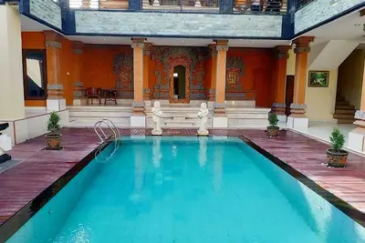 Image de Grande chambre double avec cuisine et piscine