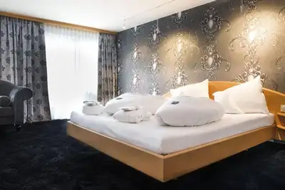 Image de Chambre confortable de luxe Sweet Dreams - Alpenhotel. . . Fall in Love