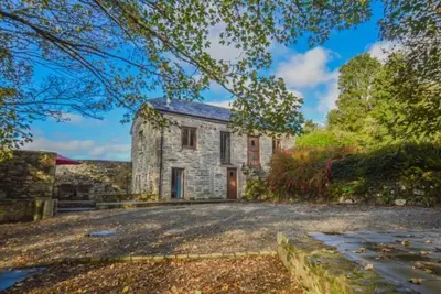 Image de L'un des deux charmants chalets dans le magnifique parc de Cusgarne House.