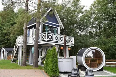 Image de maison de vacances avec jacuzzi et sauna directement au bord du lac-anc. Tui