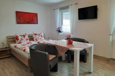 Image de Apartment \"Pfaffenstein\", living room/bedroom - Ferienhof Müller