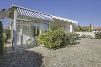 Image de Villa 2 chambres proche plage, jardin, véranda, clim, wifi à Biscarrosse