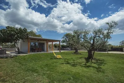 Image de Maison de vacances bien entretenue avec équipement moderne, parking, climatisation, Wlan - les animaux domestiques sont également les bienvenus.