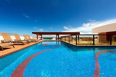 Image de Nouvel appartement avec grand toit et piscine partagés, vue ou océan