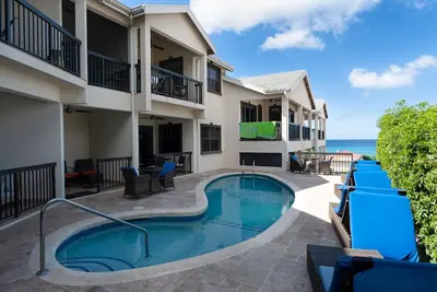 Image de Nouveau Condo 2 chambres 2 salles de bain avec piscine, à 1 min de la plage