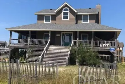 Image de Oceanside à Corolla! 100 mètres à l'eau! Voir les chevaux du pont couvert!