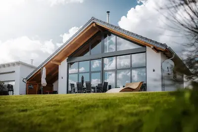 Image de Chalet100 avec plage privée, sauna, cheminée et galerie sur Mühlfeldsee