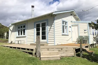 Image de Moeraki Cottage avec vue sur l'océan dans le village de Moeraki