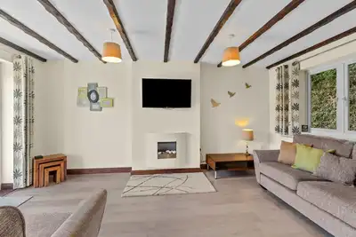Image de Rosewood Cottage est situé dans un parc privé bien entretenu à Crylla Valley Cottages qui, dans