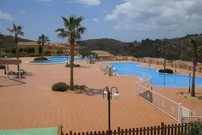 Image de Appartement Piscine Communautaire À Cumbre Del Sol Avec De Belles Vues
