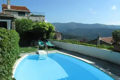 Image de Confortable appartement dans une maison de vacances avec piscine, Wifi, Tv, patio et vue panoramique