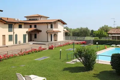 Image de Confortable appartement avec piscine, Wifi, climatisation, Tv, patio, animaux admis et parking