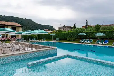 Image de Joli appartement pour 6 personnes avec Wifi, climatisation, piscine, Tv, patio et parking
