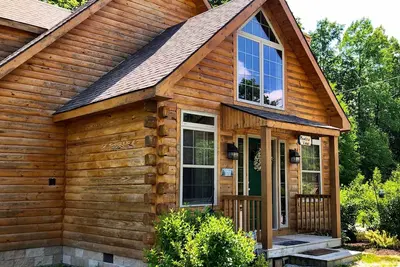 Image de Cabine spacieuse avec bain à remous et foyer au bois