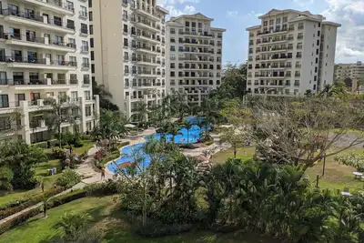 Image de Condo luxueux, 10min à pied de la plage / ville, piscine et commodités incroyables!
