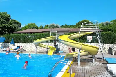 Image de Agréable appartement dans une maison de vacances avec climatisation, piscine, Wifi et terrasse