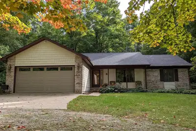 Image de Charlevoix, Michigan, maison de deux blocs de la plage