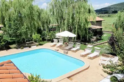 Image de Bel appartement dans une maison de vacances avec piscine, Wifi, Tv, patio, vue panoramique, parking