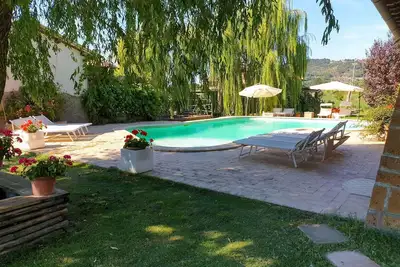 Image de Joli appartement dans une maison de vacances avec Wifi, piscine, Tv, patio, vue panoramique, parking