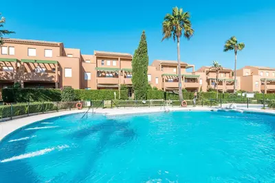 Image de Appartement de vacances \"Jardin del Golf\" avec piscine partagée et près de la plage