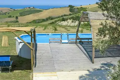 Image de Appartement dans une maison de vacances avec Wifi, piscine, bain à remous, climatisation, Tv, patio