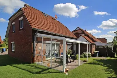 Image de Apartment on the ground floor in Neßmersiel, quiet but central