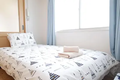 Image de Chambre Spaciou avec trois lits à côté du marché Kuromon à pied de Namba!