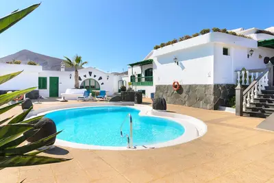 Beautiful Apartment Lanzarote with Heated Pool, Terrace, Mountain/Ocean Views & Wi-Fi; Parking Available