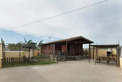 Image de Petite maison en bois dans la verdure - Villa Alberto